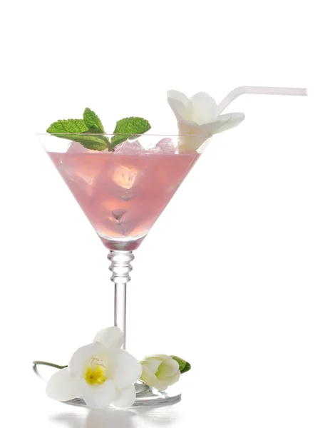 Martini glass of cocktail with ice and flowers isolated on white — Stock Photo, Image