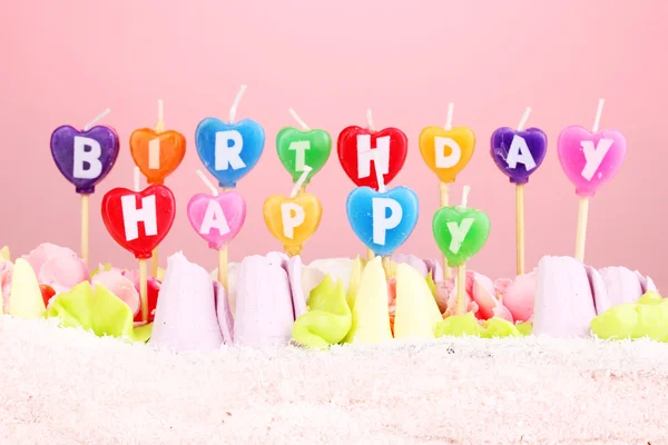 Birthday cake with candles on pink background — Stock Photo, Image