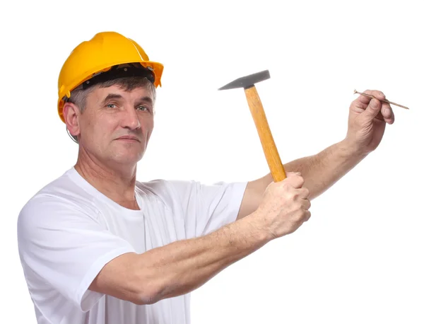 Construtor marcou um prego com um martelo isolado no branco — Fotografia de Stock