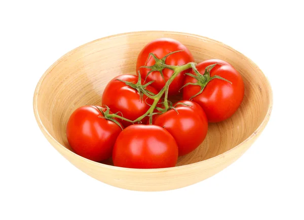 Fresh tomatoes in wooden bowl isolated on white — Stock Photo, Image