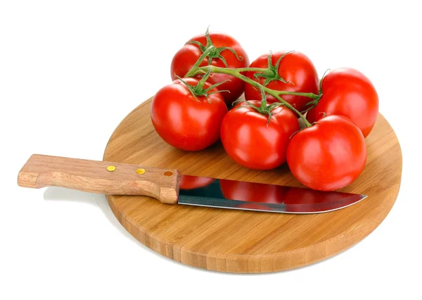 Fresh tomatoes and knife on wooden board isolated on white — Stock Photo, Image