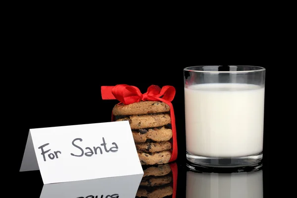 Glass of milk and cookies isolated on black — Stock Photo, Image