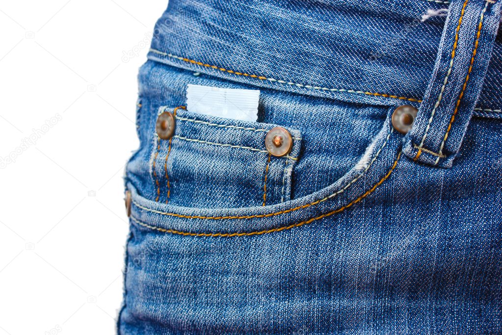 Condom in the pocket of blue jeans on white