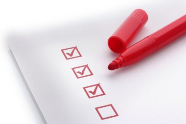 Checklist and red marker closeup clipart