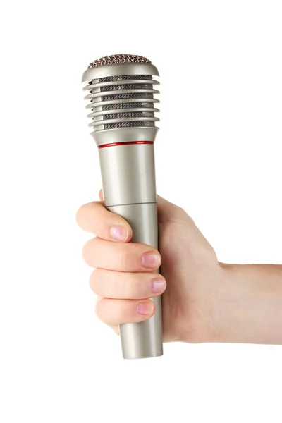 Parlak gri demir mikrofon üzerinde beyaz izole el — Stok fotoğraf