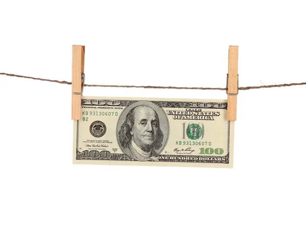 One hundred dollar bills is hanging on a rope with wooden clothespin isolated on white — Stock Photo, Image