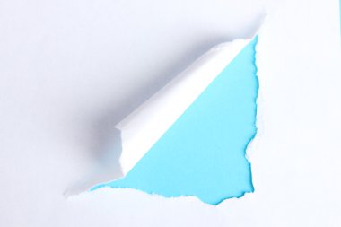 Torn paper with blue background clipart