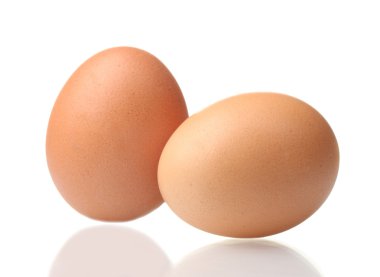 Two brown eggs isolated on white clipart