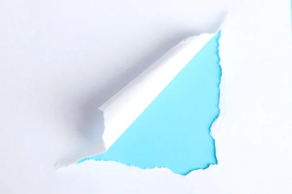 Torn księga z niebieskim tle — Zdjęcie stockowe