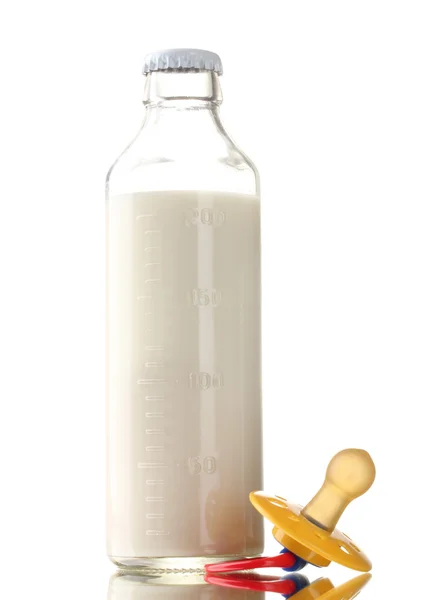 Bottle of milk and soother isolated on white — Stock Photo, Image