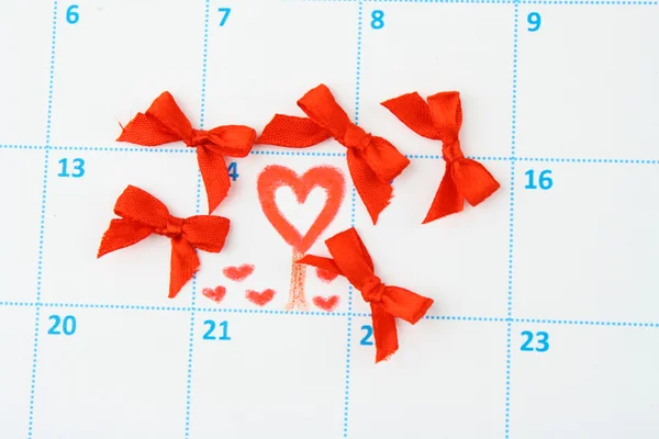 Calendar page with hearts and bows on St.Valentines Day — Stock Photo, Image