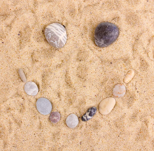 Smile-stones on sand — Stock Photo, Image