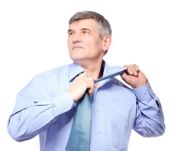 Hombre de negocios tomando una corbata aislada en blanco —  Fotos de Stock