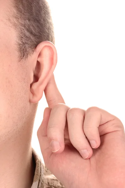 Menselijke oor en hand close-up geïsoleerd op wit — Stockfoto