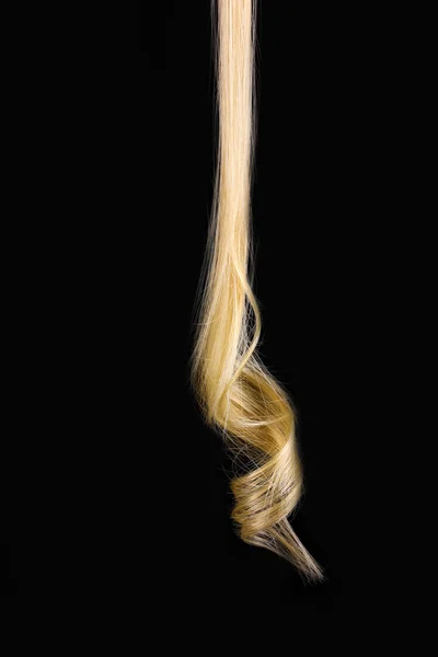 Curly blond hair isolated on black — Stock Photo, Image