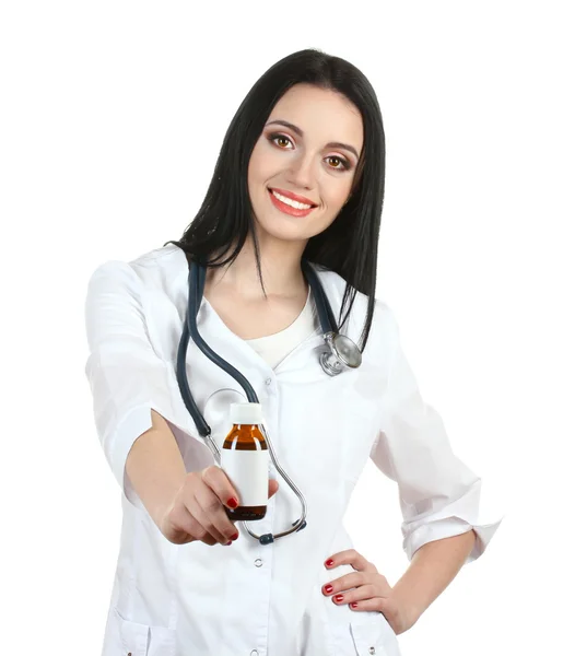 Young beautiful doctor with stethoscope holding bottle with pills isolated on white — Stock Photo, Image