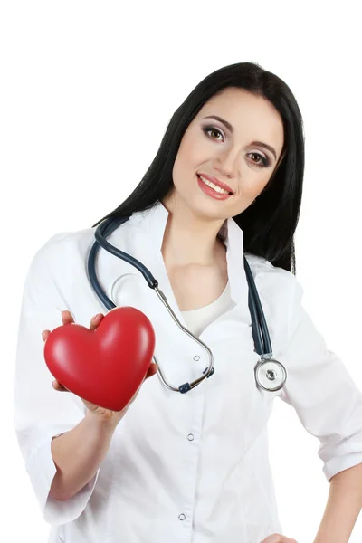 Jonge mooie arts met een stethoscoop houden hart geïsoleerd op wit — Stockfoto