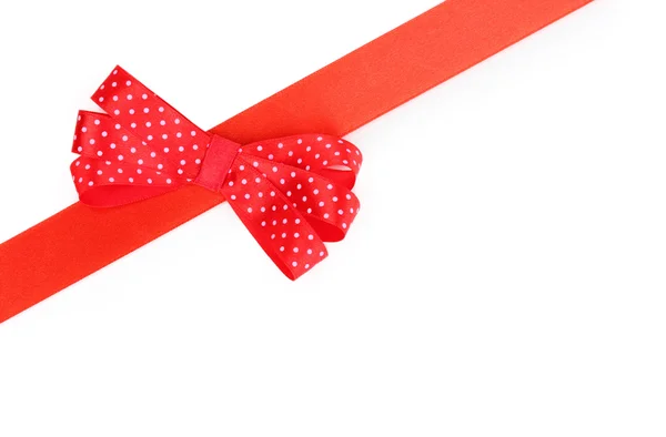 Red satin bow and ribbon isolated on white — Stock Photo, Image