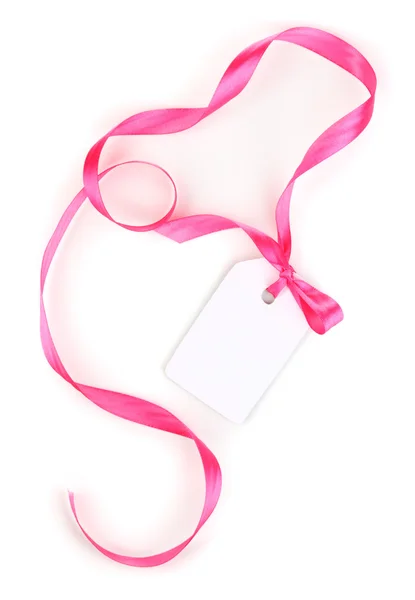 Üres ajándék címke rózsaszín szatén íj és elszigetelt fehér szalag — Stock Fotó