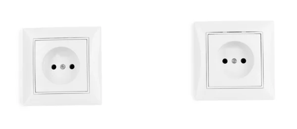 Hvide elektriske stikkontakter på væggen - Stock-foto