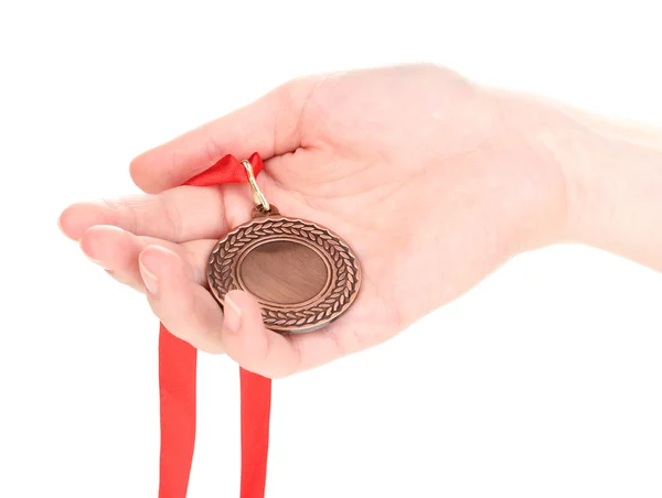 Бронзовая медаль в руке изолированы на белом — стоковое фото