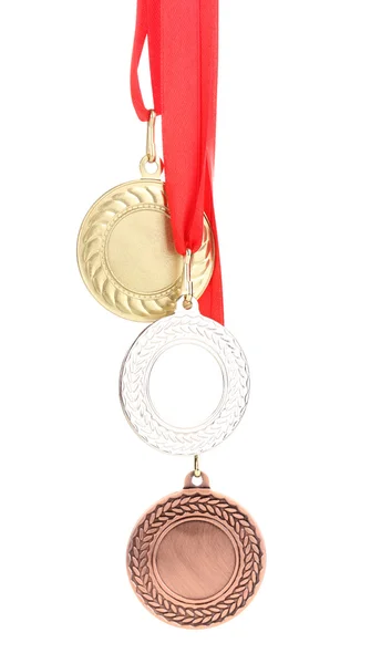 Üç madalya üzerinde beyaz izole — Stok fotoğraf