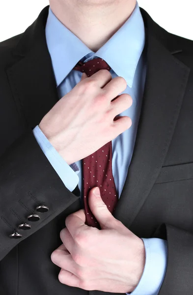 Affärsman korrigera en slips på nära håll — Stockfoto