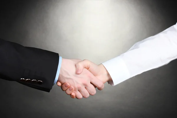 Business handshake on gray background — Stock Photo, Image