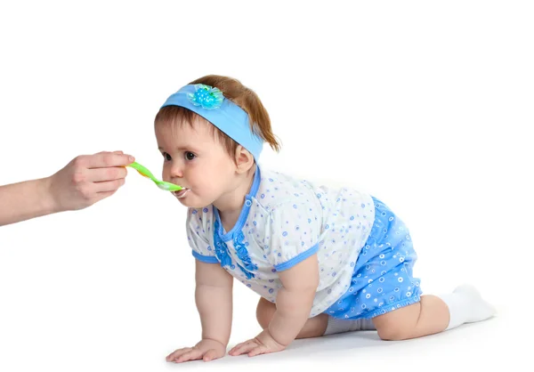 Cute baby girl eating isolated on white — Stock Photo, Image