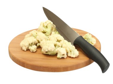 Fresh cauliflower and knife on cutting board isolated on white clipart