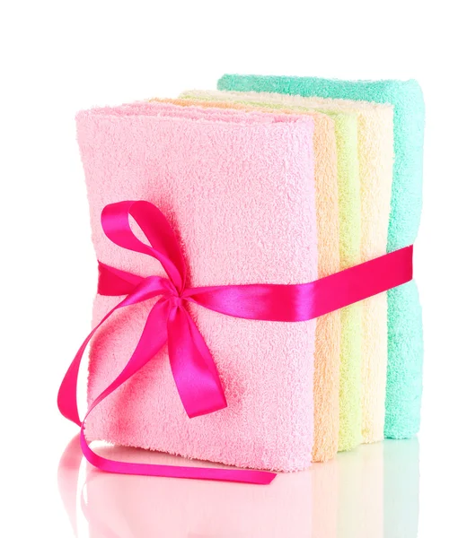 Colorful towels with ribbon isolated on white — Stock Photo, Image