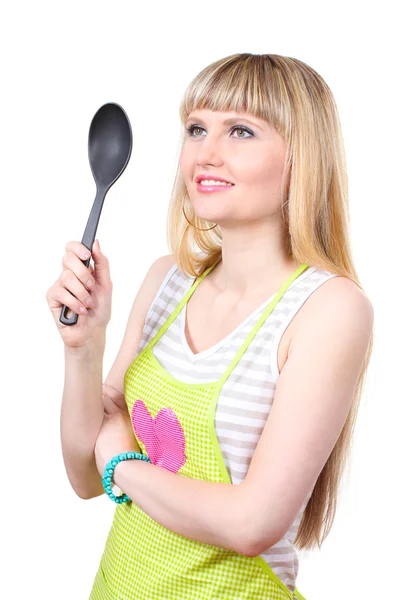 Beautiful young housewife with big spoon isolated on white — Stock Photo, Image