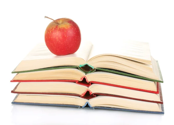Στοίβα ανοιχτά βιβλία με την apple που απομονώνονται σε λευκό — Φωτογραφία Αρχείου