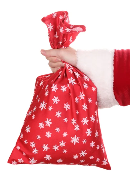 Santa claus ręka trzyma worek prezentów na białym tle — Zdjęcie stockowe