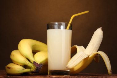 Banana juice with bananas on brown clipart