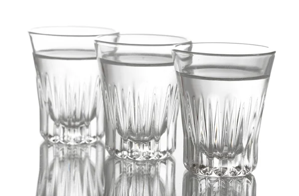 Tři sklenice vodky izolovaných na bílém — Stock fotografie
