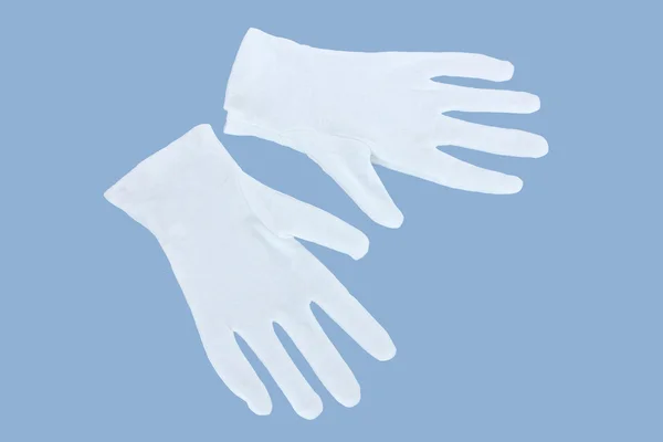 青色の背景に布製の手袋 — ストック写真