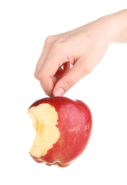 Czerwone jabłko ugryziony w rękę na białym tle — Zdjęcie stockowe