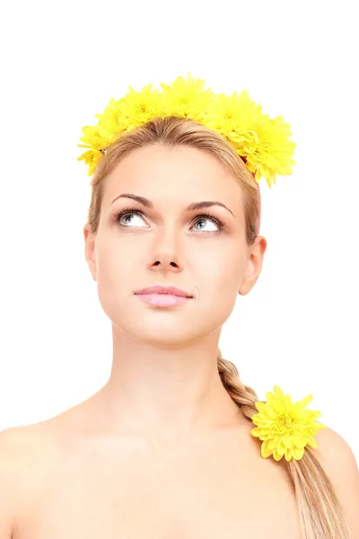 Beautiful young woman with bright yellow flowers in braid on white background close-up — Stock Photo, Image