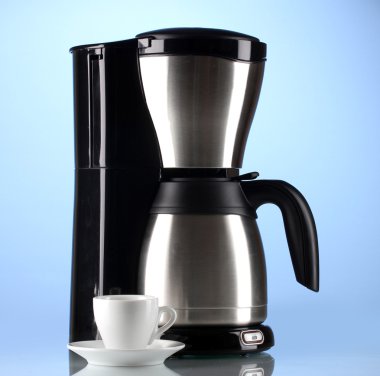 Coffee maker with white cup on blue background clipart