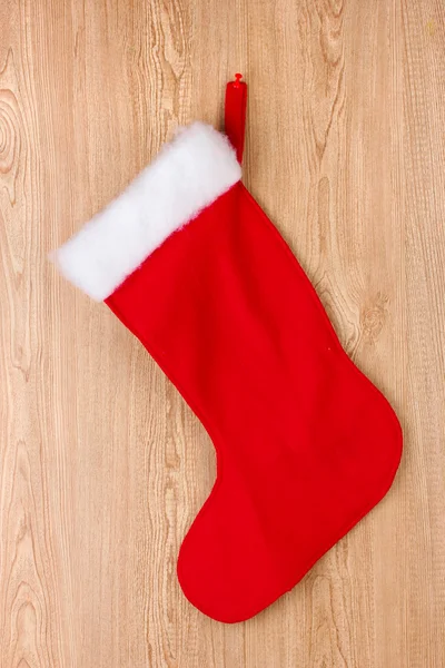 Різдвяний шкарпетка на дерев'яному фоні — стокове фото