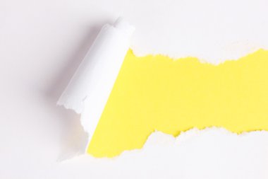 Torn paper with yellow background clipart