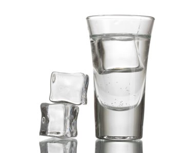 Glass of vodka with ice isolaled on white clipart