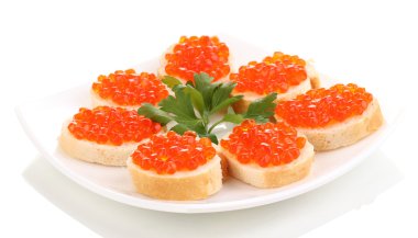 Red caviar on bread on white plate isolated on white clipart