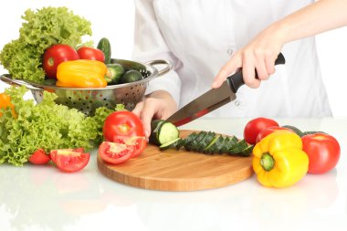 Woman hands cutting vegetables on kitchen blackboard clipart