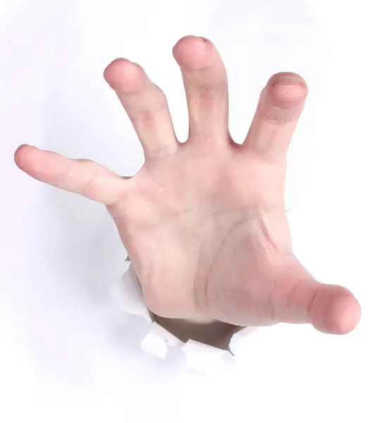 stock image Hand breaking through the paper