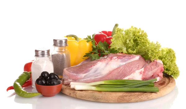 Raw meat and vegetables on a wooden board isolated on whitе — Stock Photo, Image