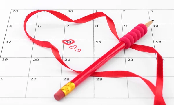Calendar page with hearts, pencil and ribbon on St.Valentines Day — Stock Photo, Image