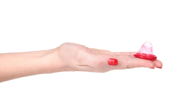 Рука тримає презерватив ізольовано на білому — стокове фото