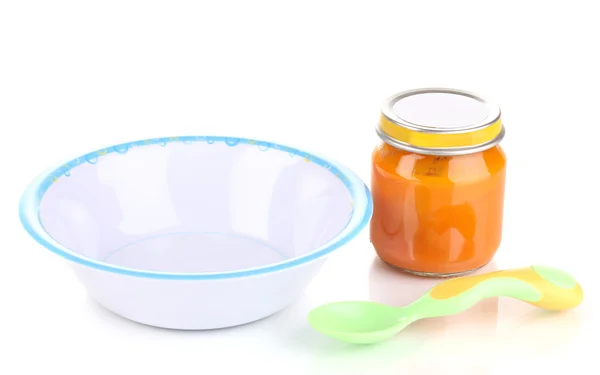 Tarro de puré de bebé con plato y cuchara aislada en blanco —  Fotos de Stock